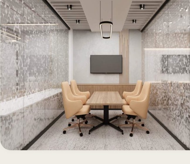 A five-seat meeting room with a wall display.