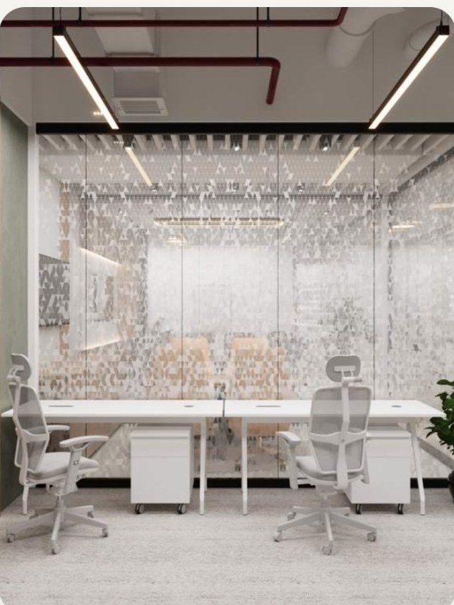 A glazed private suite with three desks and mobile storage.